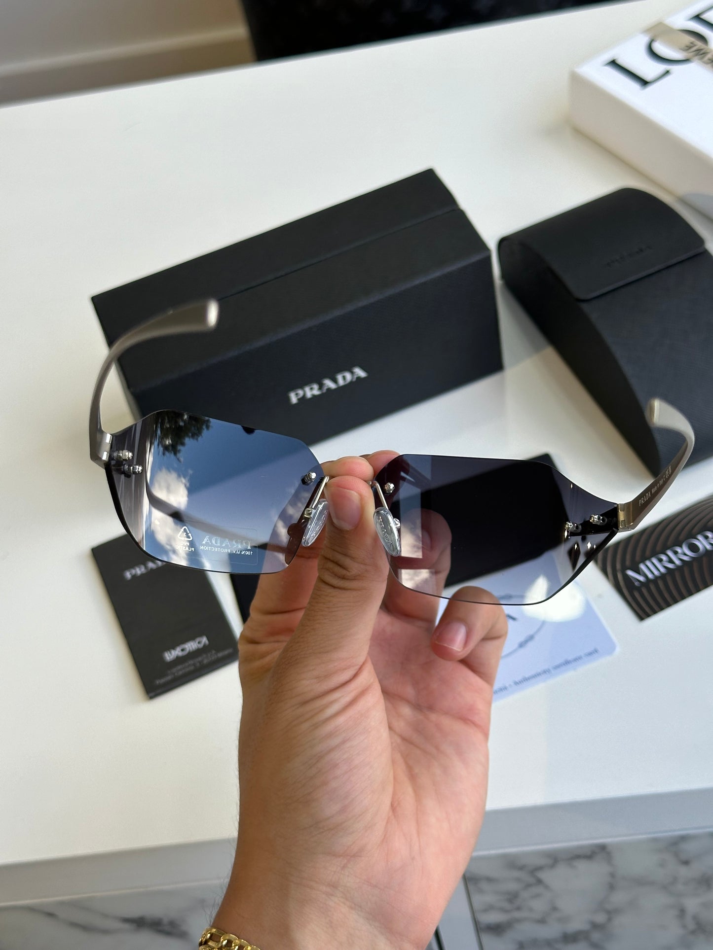 Prada curved sunglasses