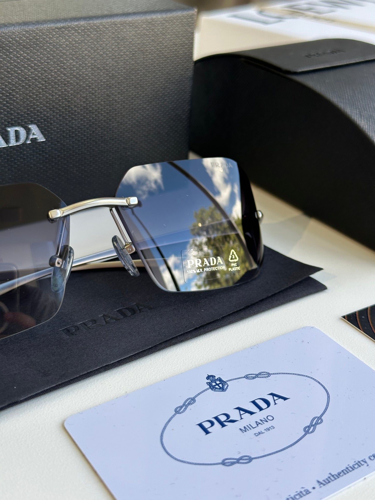 Prada curved sunglasses